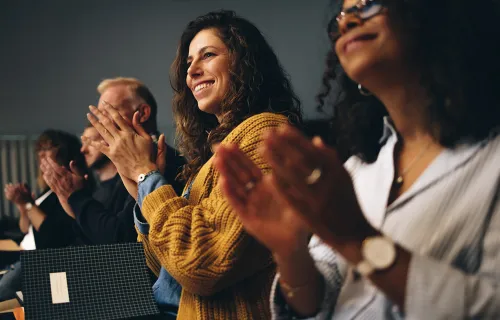a row of people applauding