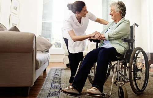 Health care worker giving support to social care resident