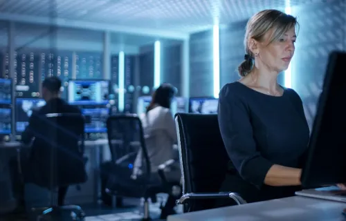 Female worker in mission control room 