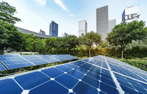 solar panels with city in background