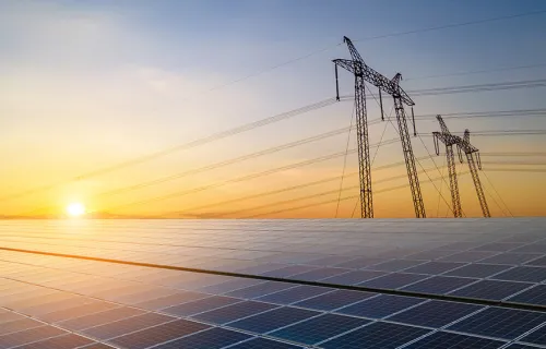 power lines and solar panels - grid modernization