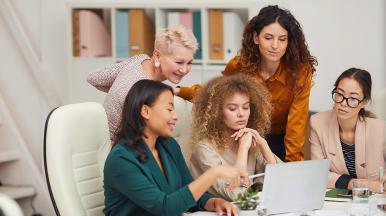 Women working together on a computer