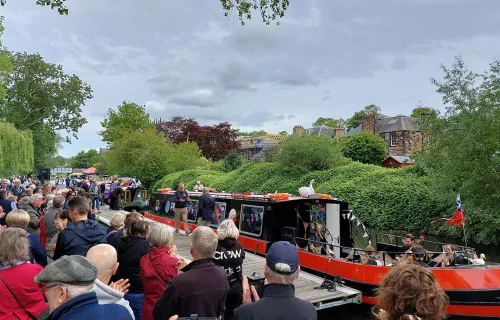 crowd of people around canal boat on the Union Canal