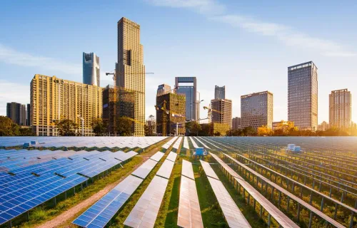 Solar farm with city scape in the background