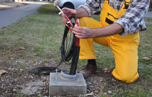 network engineer installing fibre cables