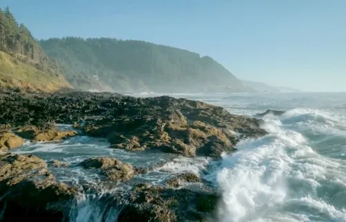 ocean waves crashing on rocky coastline