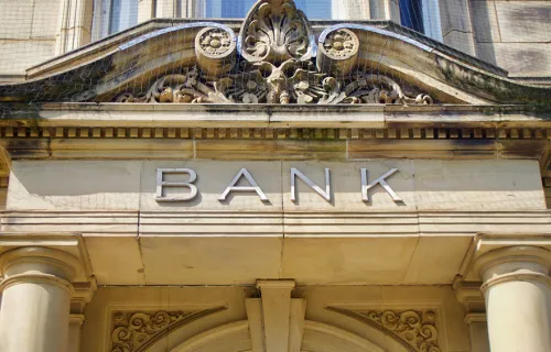 Front of an old, imposing bank building 