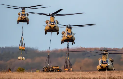 military helicopters picking up supplies
