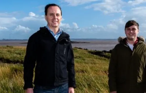 Two men stood in a seagrass meadow in the severn estuary