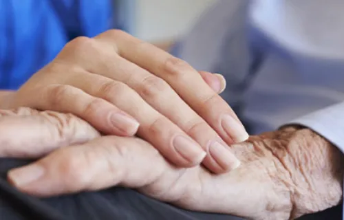 healthcare nurse placing hand on patients