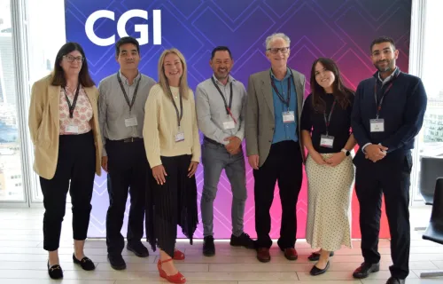 People pose for photo at CGI empowering inclusion event