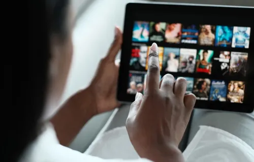 Person scrolling through tablet screen