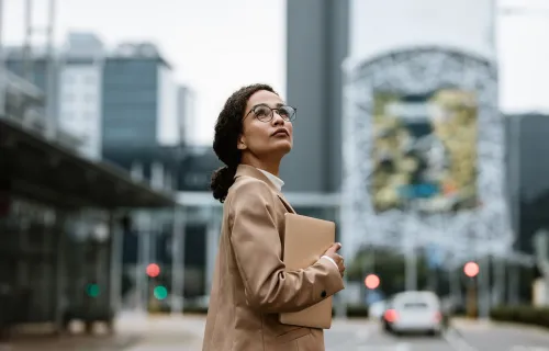 professional looking up at a city