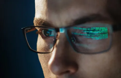Reflection of code in glasses