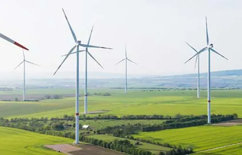 Wind farm on an open field creating renewable energy