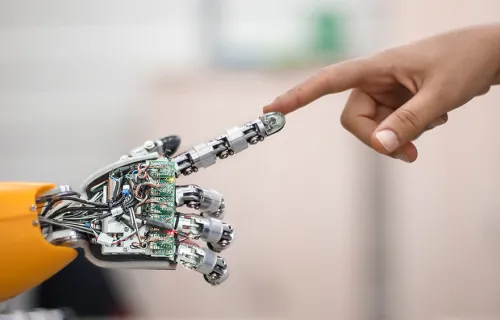 robotic hand connecting to human hand