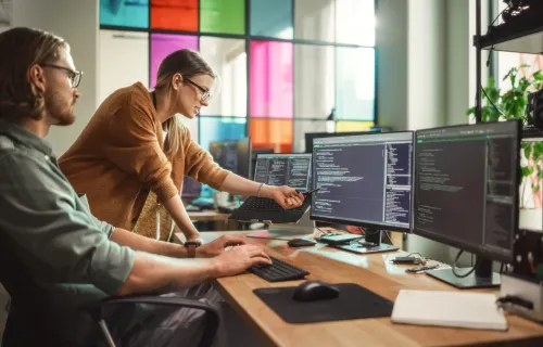 2 people on a computer