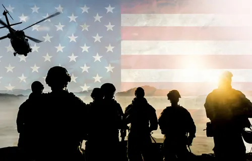 Soldiers on patrol, American flag