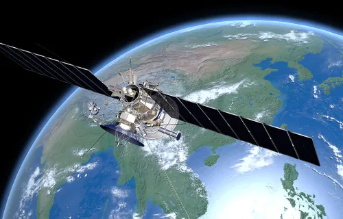 A satellite orbits the Earth, representing CGI’s role helping build the European Union’s UN:IO…