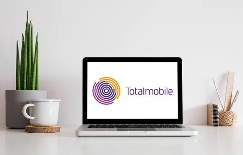 Totalmobile logo on laptop screen