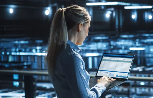 women looking at report in laptop