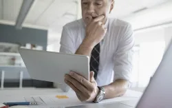 Man with tablet in office