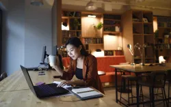 woman using laptop at home