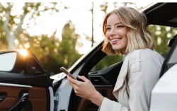 Woman stepping out of car