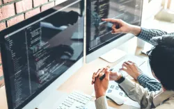Consultant points to computer screen