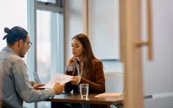 Consultant talking to customer