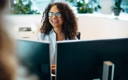 Consultant using Microsoft 365 Copilot on work computer to improve productivity