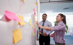 Consultants engage in a brainstorm