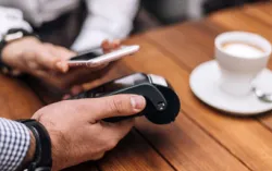 Person makes a contactless payment using their watch