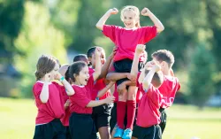 CHildren celebrating at a sports match