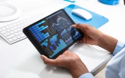 person using tablet to review data