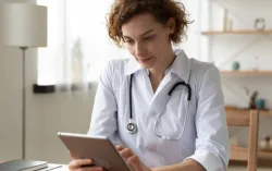 female health clinician in office with tablet