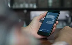 Hand using AI chat tool on a smartphone