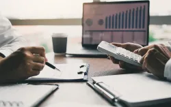 two healthcare professionals analysing data