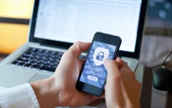 a man holding a mobile phone with a locked screen