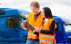 two consultants looking at the tab