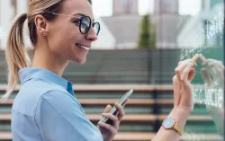 female insurance consultant looking at whiteboard