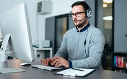 quantum consultant working at laptop