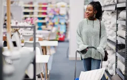 retail customer with trolley browsing Home Bargains aisle