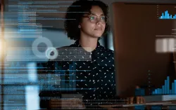female looking at space data on a pc screen