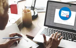 woman using laptop showing phishing training