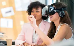 two people exploring the metaverse using a VR headset