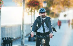 Person riding bicycle through city