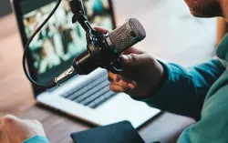 Person uses a professional microphone during a conference call