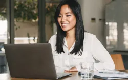 Woman visiting nhs.uk on a laptop