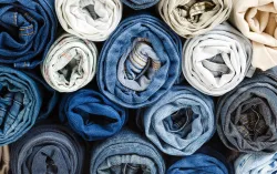 stack of different rolled jeans